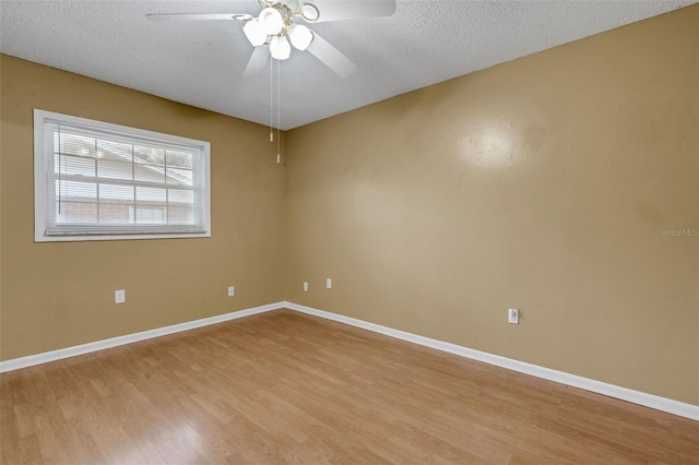 3427 S Polk Ave, Lakeland, FL 33803 - spare room with light wood-style floors, ceiling fan, a textured ceiling, and baseboards