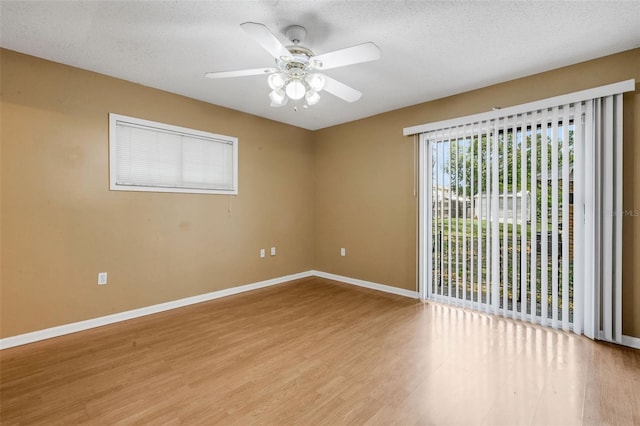 3427 S Polk Ave, Lakeland, FL 33803 - unfurnished room with light wood-style flooring, ceiling fan, baseboards, and a textured ceiling