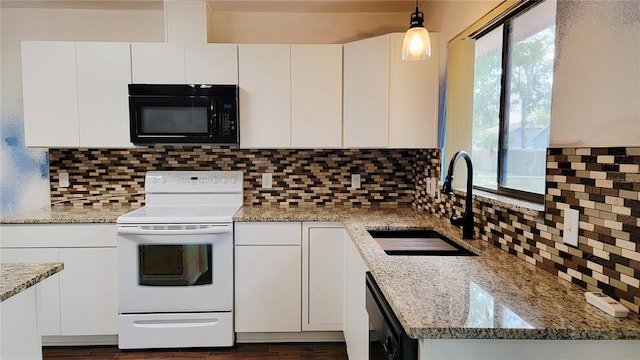 kitchen featuring black appliances, a sink, white cabinets, and light stone counters