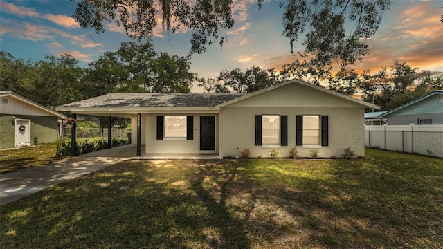 3829 Abbott Ln, Lakeland, FL 33810 - ranch-style house with concrete driveway, a carport, and stucco siding