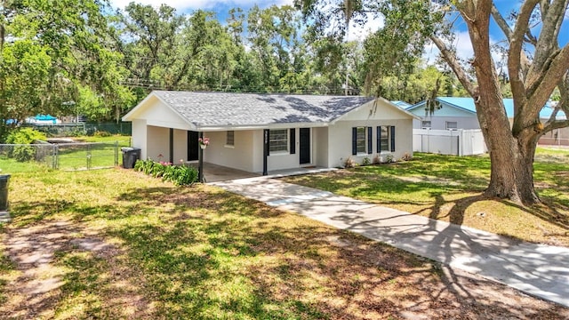 3829 Abbott Ln, Lakeland, FL 33810 - ranch-style home featuring driveway, a carport, stucco siding, a shingled roof, and view of scattered trees