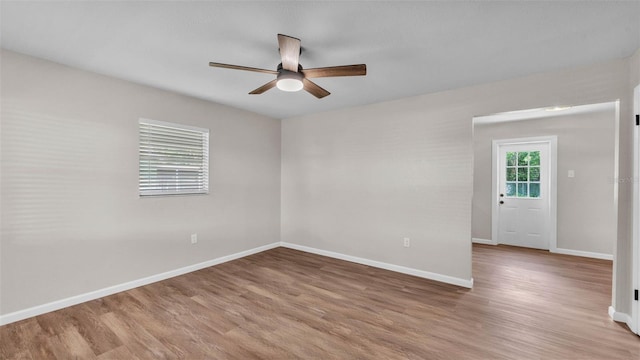 3829 Abbott Ln, Lakeland, FL 33810 - empty room featuring a ceiling fan, wood finished floors, and baseboards
