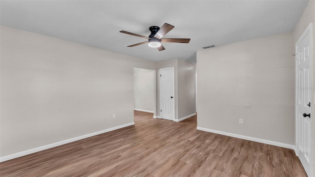 3829 Abbott Ln, Lakeland, FL 33810 - spare room featuring ceiling fan, wood finished floors, and baseboards