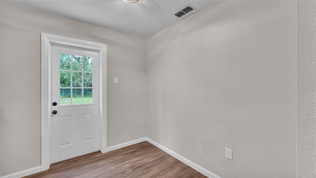 3829 Abbott Ln, Lakeland, FL 33810 - doorway to outside with baseboards and wood finished floors