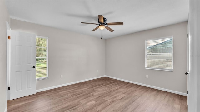 3829 Abbott Ln, Lakeland, FL 33810 - empty room featuring wood finished floors, healthy amount of natural light, and ceiling fan