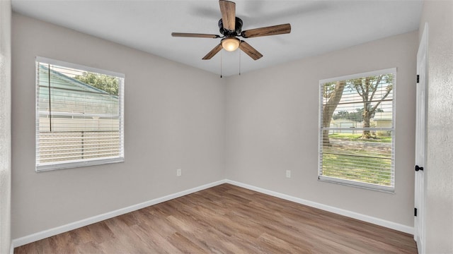 3829 Abbott Ln, Lakeland, FL 33810 - spare room with plenty of natural light, wood finished floors, and baseboards