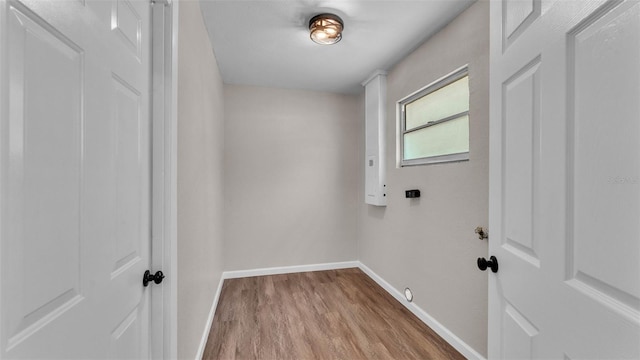 3829 Abbott Ln, Lakeland, FL 33810 - laundry room with baseboards and wood finished floors