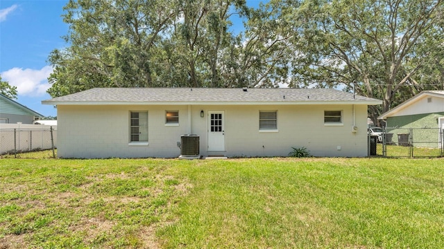 3829 Abbott Ln, Lakeland, FL 33810 - rear view of property with concrete block siding, central AC unit, a gate, and a shingled roof