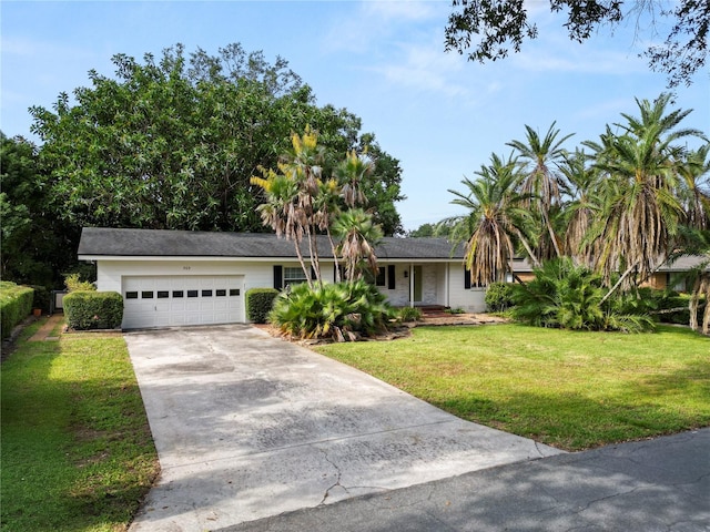 509 Rob Roy St, Lakeland, FL 33813 - view of front facade with an attached garage, driveway, and a front yard