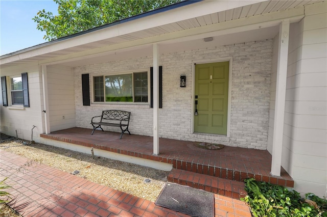 509 Rob Roy St, Lakeland, FL 33813 - view of exterior entry with covered porch and brick siding
