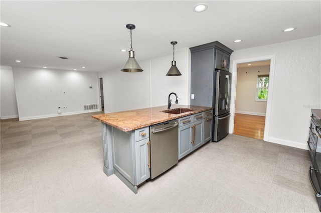 509 Rob Roy St, Lakeland, FL 33813 - kitchen featuring stainless steel appliances, a sink, gray cabinets, light stone countertops, and pendant lighting