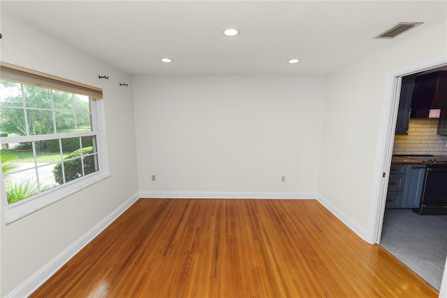 509 Rob Roy St, Lakeland, FL 33813 - empty room with light wood finished floors, baseboards, and recessed lighting