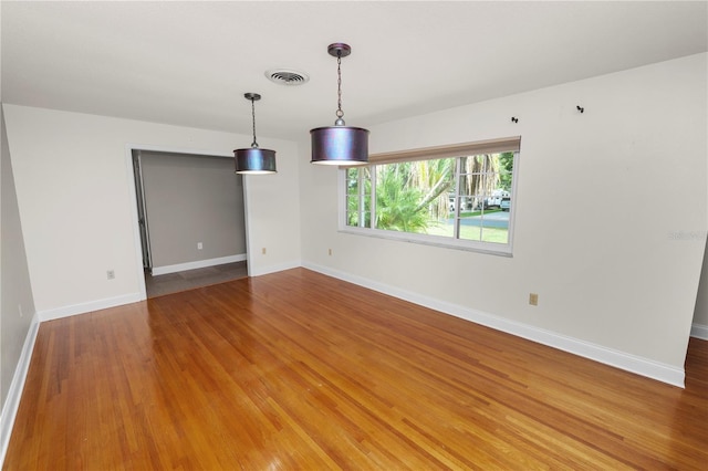 509 Rob Roy St, Lakeland, FL 33813 - unfurnished room with wood finished floors and baseboards