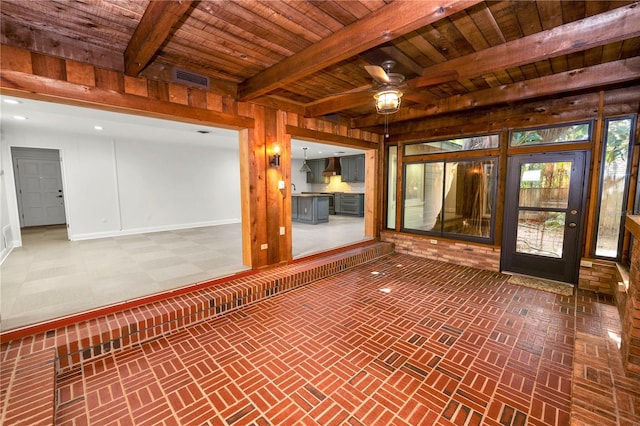 509 Rob Roy St, Lakeland, FL 33813 - unfurnished sunroom featuring beam ceiling