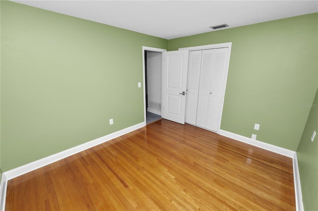 509 Rob Roy St, Lakeland, FL 33813 - unfurnished bedroom featuring baseboards, a closet, and light wood-style floors
