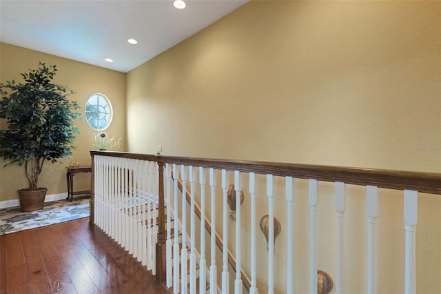 2731 Coventry Ave, Lakeland, FL 33803 - corridor featuring wood-type flooring, an upstairs landing, recessed lighting, and baseboards