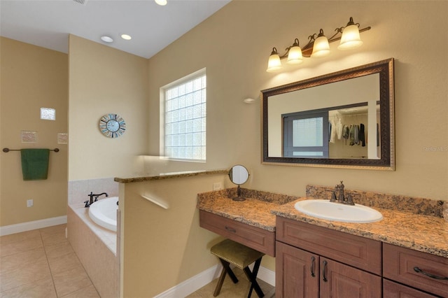 2731 Coventry Ave, Lakeland, FL 33803 - bathroom with a bath, vanity, tile patterned flooring, baseboards, and recessed lighting