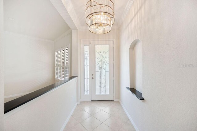 2425 Laurel Glen Dr, Lakeland, FL 33803 - tiled entrance foyer featuring ornamental molding and a chandelier