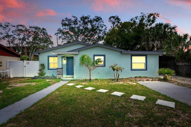 1648 Skinner St, Lakeland, FL 33801 - view of front facade with stucco siding and a gate