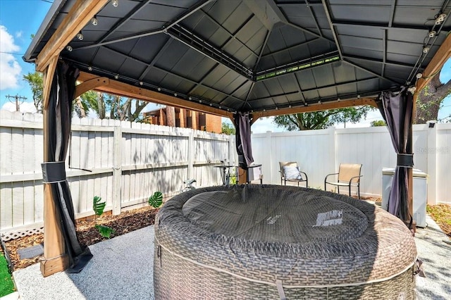 1648 Skinner St, Lakeland, FL 33801 - fenced backyard with a gazebo, outdoor dining space, and a patio