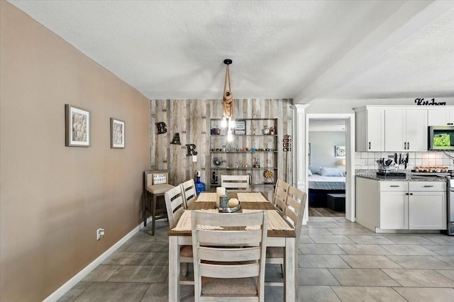 1648 Skinner St, Lakeland, FL 33801 - dining space featuring baseboards and a textured ceiling