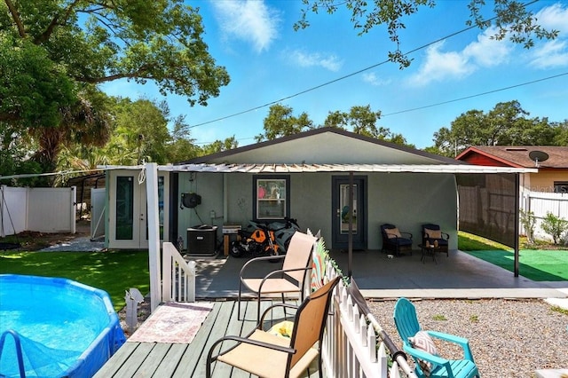 1648 Skinner St, Lakeland, FL 33801 - back of house with stucco siding and a patio area