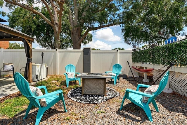 1648 Skinner St, Lakeland, FL 33801 - fenced backyard with a fire pit and a gazebo