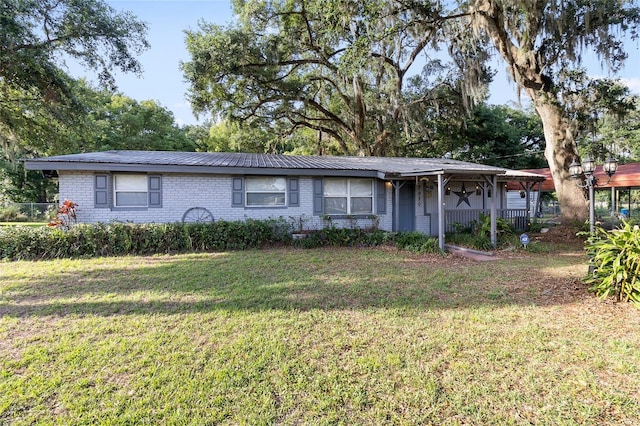 2920 Audie Combee Rd, Lakeland, FL 33801 - single story home with brick siding and a front lawn