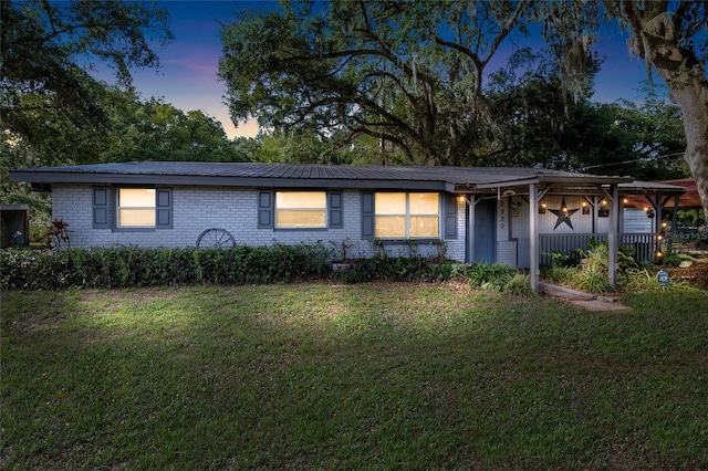 2920 Audie Combee Rd, Lakeland, FL 33801 - ranch-style house featuring a front yard, a porch, and brick siding
