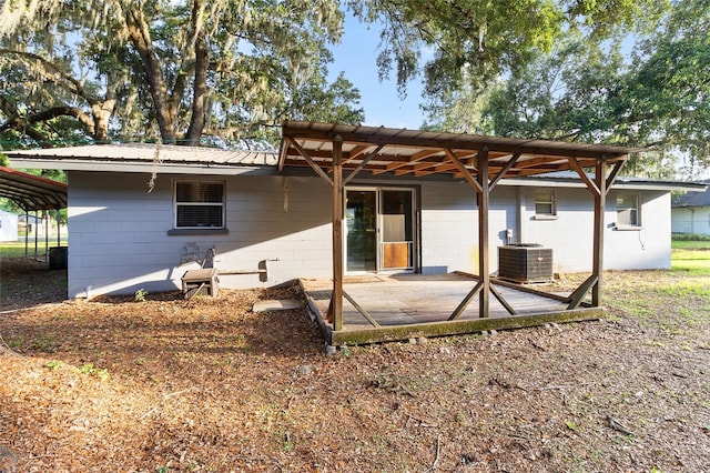 2920 Audie Combee Rd, Lakeland, FL 33801 - back of property featuring central AC unit, a patio, concrete block siding, and metal roof