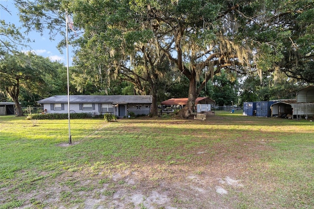 2920 Audie Combee Rd, Lakeland, FL 33801 - view of front facade featuring a detached carport and view of wooded area