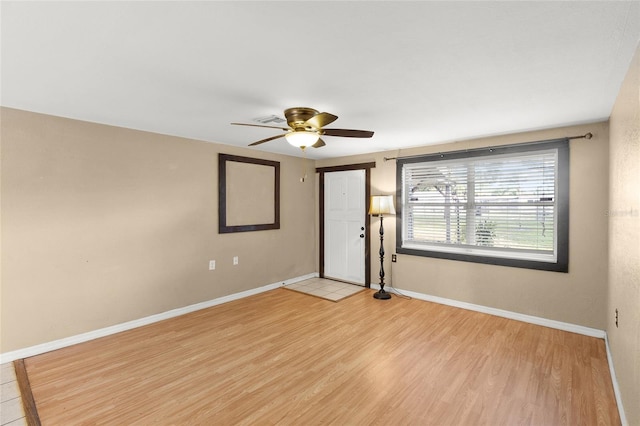 2920 Audie Combee Rd, Lakeland, FL 33801 - unfurnished room featuring ceiling fan, light wood finished floors, and baseboards