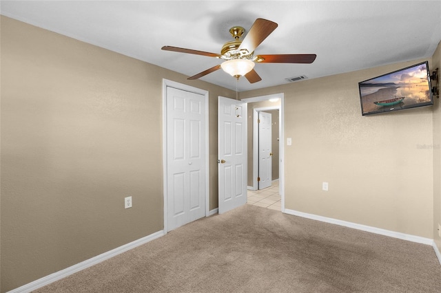 2920 Audie Combee Rd, Lakeland, FL 33801 - unfurnished bedroom with light colored carpet, a ceiling fan, baseboards, and a closet