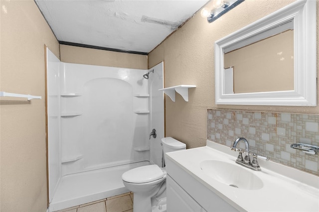 2920 Audie Combee Rd, Lakeland, FL 33801 - full bathroom featuring backsplash, a shower, vanity, toilet, and tile patterned floors