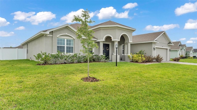 1146 Enclave Ct, Auburndale, FL 33823 - mediterranean / spanish house with stucco siding, an attached garage, and driveway