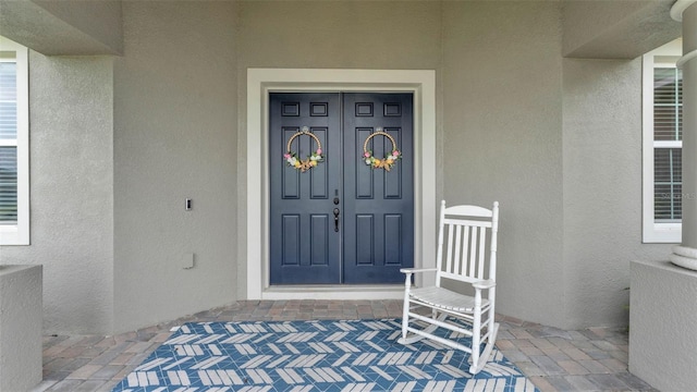 1146 Enclave Ct, Auburndale, FL 33823 - doorway to property with stucco siding