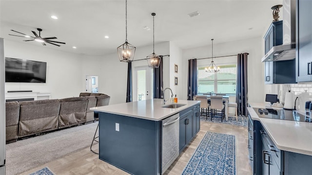 1146 Enclave Ct, Auburndale, FL 33823 - kitchen with a sink, stainless steel dishwasher, blue cabinets, a chandelier, and light countertops