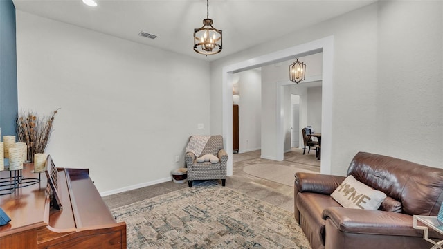 1146 Enclave Ct, Auburndale, FL 33823 - sitting room with a chandelier, baseboards, and carpet flooring