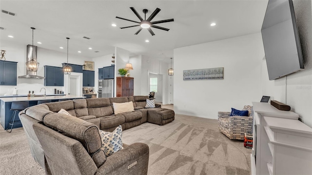 1146 Enclave Ct, Auburndale, FL 33823 - living room featuring light carpet, ceiling fan, recessed lighting, and baseboards