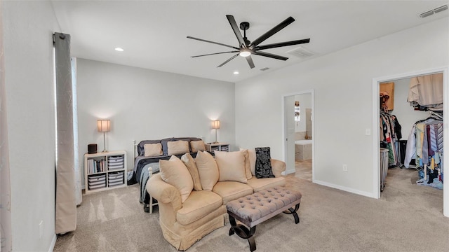 1146 Enclave Ct, Auburndale, FL 33823 - bedroom with carpet flooring, a walk in closet, ensuite bathroom, recessed lighting, and ceiling fan