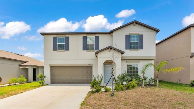 2546 Red Egret Dr, Bartow, FL 33830 - traditional-style house featuring an attached garage, stucco siding, and driveway