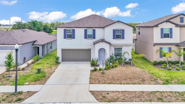 2546 Red Egret Dr, Bartow, FL 33830 - traditional-style home with stucco siding, driveway, a garage, and a shingled roof