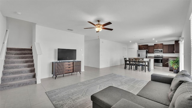 2546 Red Egret Dr, Bartow, FL 33830 - living room with light tile patterned flooring, a ceiling fan, stairs, and recessed lighting