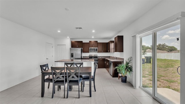 2546 Red Egret Dr, Bartow, FL 33830 - dining area with recessed lighting and light tile patterned flooring