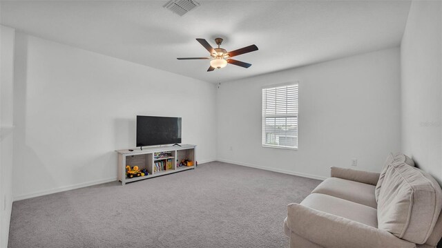 2546 Red Egret Dr, Bartow, FL 33830 - living area with a ceiling fan, carpet, and baseboards