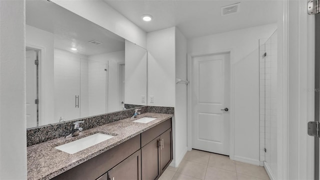 2546 Red Egret Dr, Bartow, FL 33830 - full bathroom featuring a stall shower, double vanity, tile patterned floors, and recessed lighting