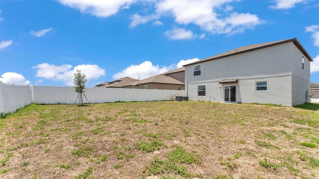 2546 Red Egret Dr, Bartow, FL 33830 - back of house featuring central AC unit and stucco siding