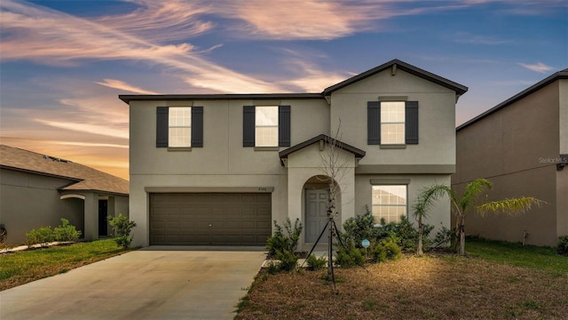 2546 Red Egret Dr, Bartow, FL 33830 - traditional-style home featuring stucco siding, a garage, and concrete driveway
