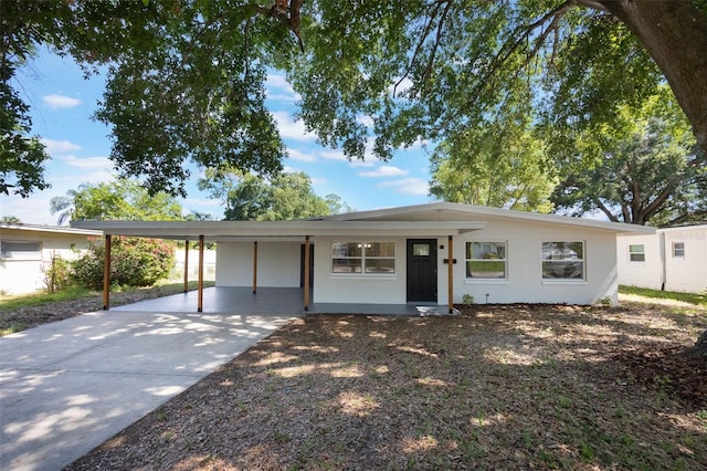 3813 Surrey Dr, Orlando, FL 32812 - ranch-style house featuring an attached carport and concrete driveway
