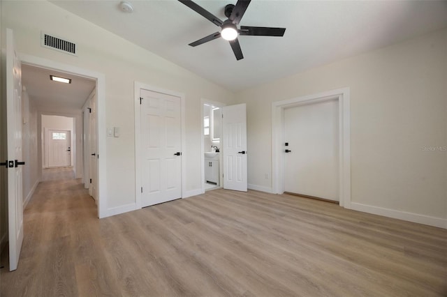 3813 Surrey Dr, Orlando, FL 32812 - unfurnished bedroom with light wood-type flooring, vaulted ceiling, baseboards, and ceiling fan